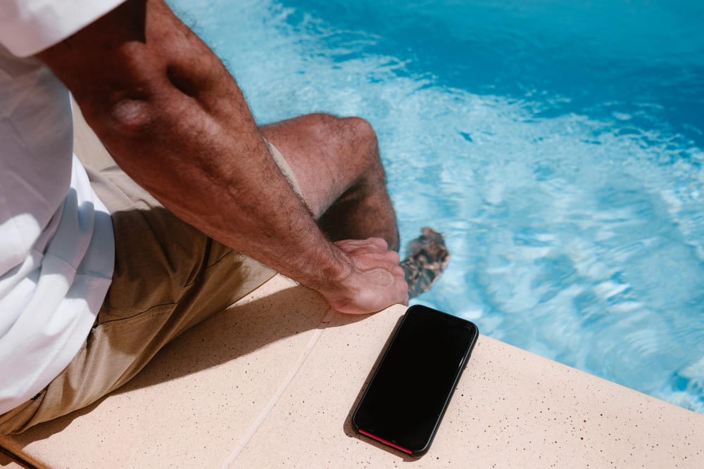 Phone by swimming pool